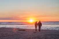 Enjoy a stroll down the beach in front of Kalaloch Lodge to watch the sunset.